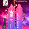 Image promotionnelle pour Bang Blaze Shisha montrant deux appareils de vapotage rose et violet dégradés étiquetés « Cherry Blossom Grapes », une bouteille d'e-liquide et des fonctionnalités telles que « 40 000 bouffées », « Type-C », « 1 000 mAh », « 40 ml » et « 0,6 Ω Mesh Coil », avec un narguilé en arrière-plan et une palette de couleurs violet-rose vibrante.