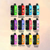 カラフルなラベルが付いた 12 個の Vape デバイスが展示されています。各デバイスは、スイカ、ストロベリー スイカ、ブルーベリー アイス、ブルーベリー ラズベリー、Love66、クランベリー グレープ アイス、ピーチ アイス、ストロベリー マンゴー、トリプル ベリー、マンゴー ピーチ、サマー タイム、パイナップル ココナッツなど、異なるフレーバーを表しており、柔らかいグラデーションの背景にグリッド状に配置されています。