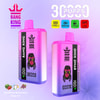 Two Bang King Disposable Vapes With Pink-Purple Gradient Design, Featuring Cartoon Character Artwork, Brand Logo, And Highlighting Features Like 30000 Puffs, Type-C Charging, 550Mah Battery, 36Ml Capacity, Mesh Coil, And Listed Flavors Strawberry Watermelon And Grape Ice.