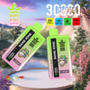 Two Bang King Delphtech Vape Devices With A Colorful Monkey Logo, Labeled Strawberry Kiwi And Peach Ice Flavors, Displayed Against A Serene Landscape With Trees And A Lake, Highlighting Features Like 30000 Puffs, Type-C Charging, 550Mah Battery, And 36Ml Capacity.