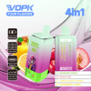 Vopk Four Flavors 4-In-1 Vape Device Featuring Digital Display, 650Mah Battery, Type-C Charging, And Four E-Liquid Flavors (Rainbow Candy, Peach Ice, Lemon Sour Orange, Cranberry Lemon), Shown With Illustrated Lion Character And Assorted Fruit Visuals.
