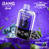 A Vape Device With A Gorilla Logo On The Front Is Shown Against A Purple Background, Surrounded By Splashing Water, Blueberries With Ice, And Black Currants, Emphasizing The Blueberry Ice &Amp; Black Currant Flavor.