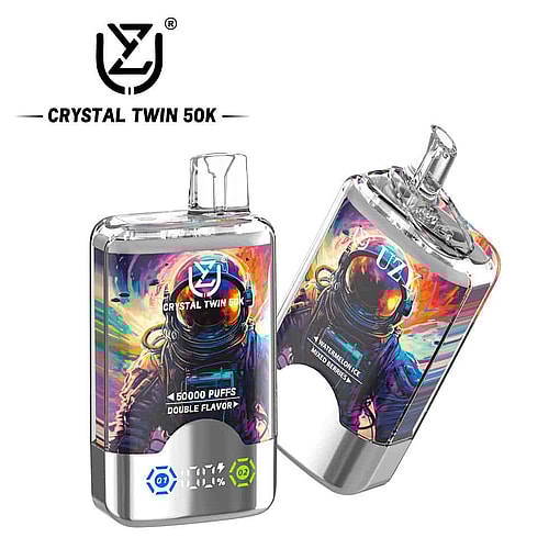 Two Crystal Twin 50K Disposable Vape Devices With Colorful Astronaut Artwork, Metallic Silver Accents, Digital Display, And Double Flavor Option, One Standing Upright And One Leaning Sideways.