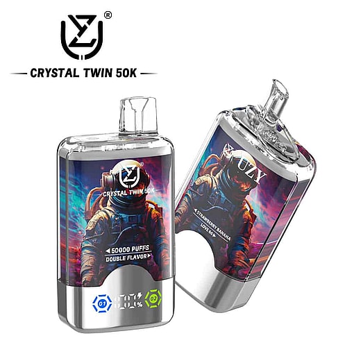 Two Crystal Twin 50K Vape Devices With Colorful Astronaut Artwork On The Labels, One Standing Upright And The Other Tilted, Featuring Branding And Digital Indicators On The Metallic Base.