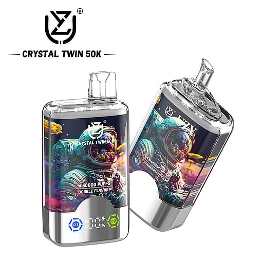 Two Crystal Twin 50K Vape Devices Featuring Colorful Astronaut Artwork, Metallic Accents, And Clear Mouthpieces, With Product Branding And Flavor Details Visible.