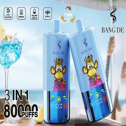 Two Blue Bang De Disposable Vape Devices Featuring A Cartoon Monkey Wearing A Crown And A Pink Hoodie, With Icons And Text Indicating 3-In-1 Flavor, 650Mah Battery, And 80,000 Puffs, Set Against A Beach-Themed Background With A Blue Cocktail And Sunglasses.