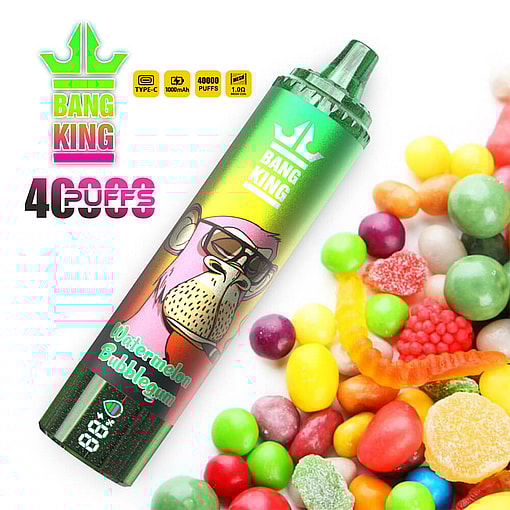 Bang King Watermelon Bubblegum Vape Device Featuring A Colorful Cartoon Ape Character, Set Next To Assorted Candy Pieces And Labeled With 40,000 Puffs And Battery Indicators.