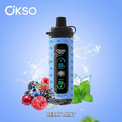 Dispositivo elettronico Okso blu con display digitale, circondato da more, lamponi, mirtilli, ribes, foglie di menta e schizzi d’acqua, etichettato 'Berry Mint' su sfondo blu.