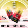 Twee Bang King Delphtech Vape-apparaten met de smaken Strawberry en Black Dragon Ice, tegen een gestileerd roze en geel landschap, met pictogrammen die de dubbele smaak, mesh-coil, instelbare luchtstroom en digitaal display benadrukken.