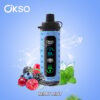 Blauw OKSO elektronisch vape -apparaat met digitaal display, omgeven door bramen, frambozen, bosbessen, krenten, mintbladeren en waterspatten, met het label 'Berry Mint' op een blauwe achtergrond.