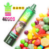 Bang King Watermelon bubblegum vape -apparaat met een kleurrijk cartoonap -personage, ingesteld naast diverse snoepstukken en gelabeld met 40.000 suffels en batterij -indicatoren.