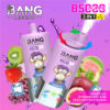 Bang Legend 3-in-1 wegwerpevapelapparaat met cartoon aapafbeelding, omgeven door fruit, waaronder kiwi, aardbei, druiven, ijsblokje, guave en passievrucht, het benadrukken van smaken druivenijs, aardbeien kiwi en passievrucht guava, tegen een paarse achtergrond.