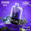 A Vape Device With A Gorilla Logo On The Front Is Shown Against A Purple Background, Surrounded By Splashing Water, Blueberries With Ice, And Black Currants, Emphasizing The Blueberry Ice &Amp; Black Currant Flavor.